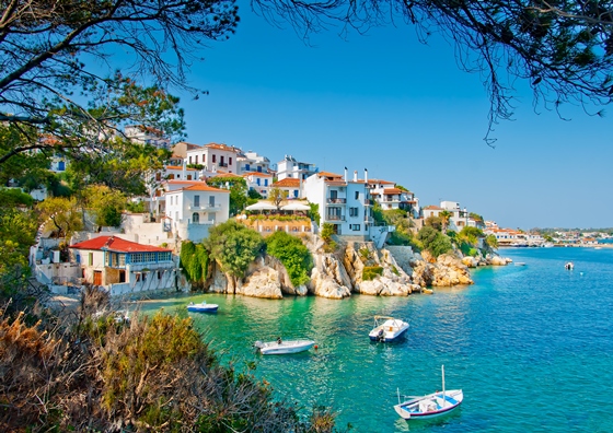 Green mountainsides and clear water on the islands of the Sporades