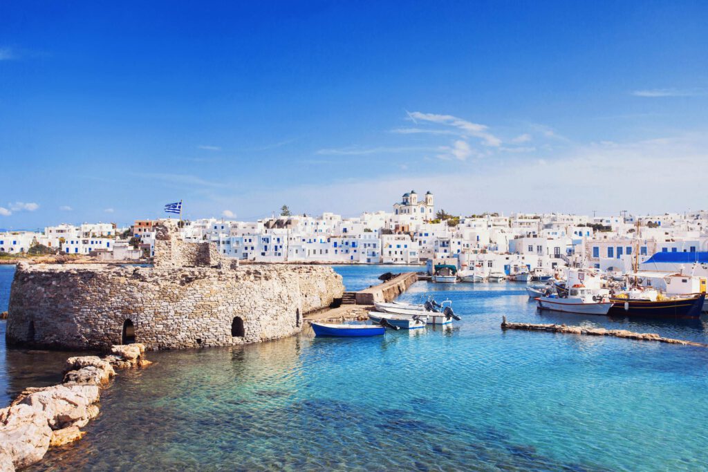 discover with island hopping Cyclades the typical place Naoussa on the island Paros